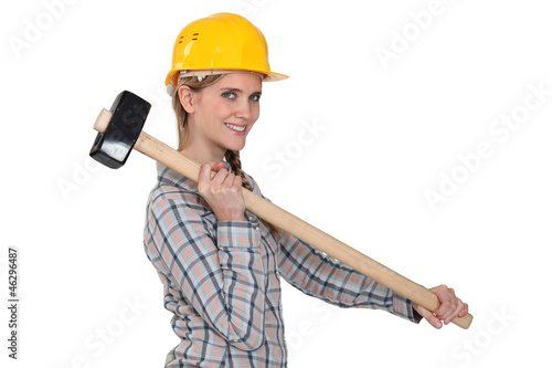 Photo: craftswoman holding a huge hammer craftswoman holding a huge hammer