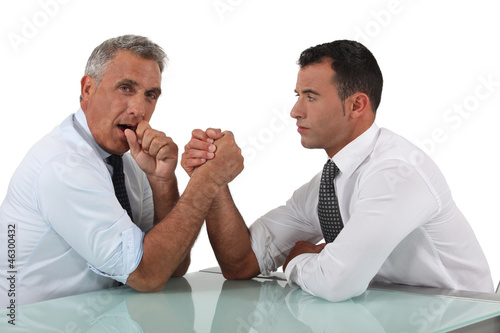 Photo: Businessmen doing arm wrestling Businessmen doing arm wrestling