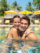 Beautiful couple enjoying in the swimming pool