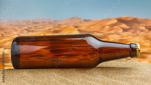 Photo: bottle of beer in desert bottle of beer in desert