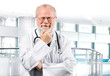 pensive senior medical doctor in clinic