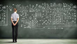 Business person against the blackboard