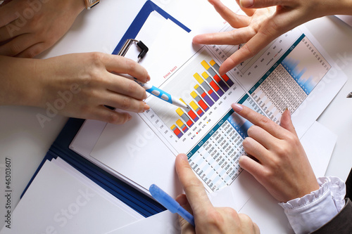 Photo: Financial papers on the table Financial papers on the table