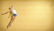 young woman dancing and jumping...