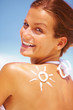 Woman with drawn sun on back