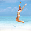 Happy woman enjoying on beach