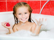 girl in the bath with a soap