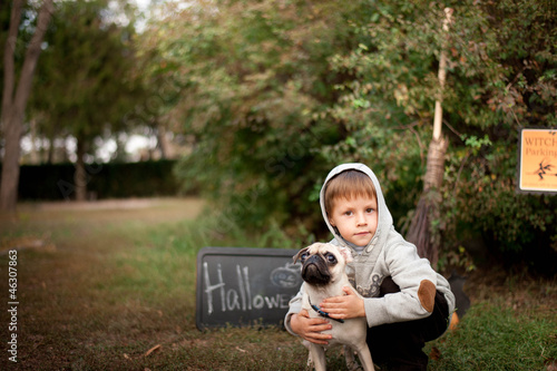 Photo: the nature boy hugs his beloved dog breed pug the nature boy hugs his beloved dog breed pug