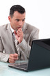 A businessman holding his breath