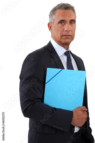 Photo: Businessman holding a blue folder Businessman holding a blue folder