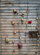 Handmade bells on wooden wall