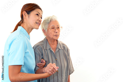 Photo: 笑顔の介護師と高齢者 笑顔の介護師と高齢者