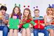 Cheerful teenagers with presents