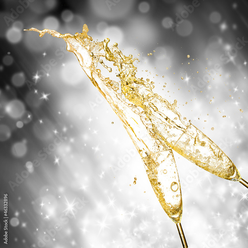 Photo: Celebration theme with splashing champagne Celebration theme with splashing champagne