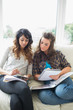 Photo: Two girls doing their homework Two girls doing their homework