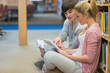 People sitting on the floor at the library