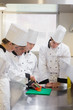 Culinary students learning how to chop vegetables