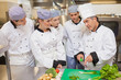 Trainees learning vegetable slicing