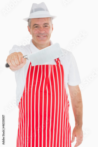 Photo: Butcher holding out meat cleaver Butcher holding out meat cleaver