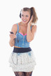 Photo: Blonde woman listening to music while smiling Blonde woman listening to music while smiling