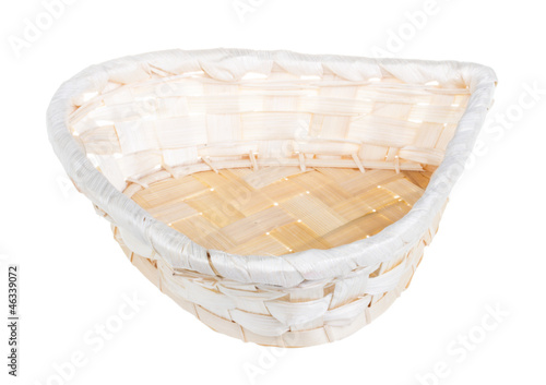 Photo: Wickerwork empty yellow breadbasket on white background Wickerwork empty yellow breadbasket on white background