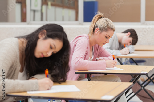 Photo: Students writing during an exam Students writing during an exam