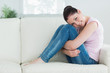 Woman relaxing while sitting in a living room