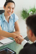 Foto: Smiling businesswoman shaking man's hand Smiling businesswoman shaking man's hand