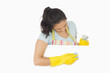 Woman wiping white surface