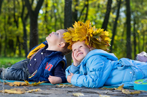 Photo: Children having fun in an autumn park Children having fun in an autumn park