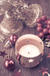 Burning Christmas candle and decorations