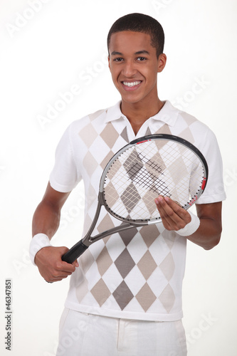 Photo: Man stood with tennis racket Man stood with tennis racket