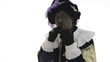 Zwarte Piet is eating a chocolate letter