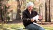 Video: Smiling senior Caucasian man receiving good news in mail and showing paper to camera Smiling senior Caucasian man receiving good news in mail and showing paper to camera