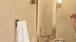 Mixed race woman brushing her teeth in the bathroom