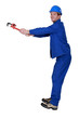 craftsman screwing with a spanner
