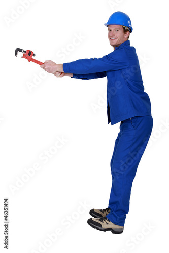 Photo: craftsman screwing with a spanner craftsman screwing with a spanner