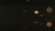 Coins falling onto black granite (slow motion)