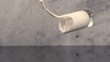 Glass of milk falling to granite surface and breaks, spilling milk (slow motion)