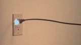 Video: Power cord snakes into the frame and plugs into the wall socket with sparks (slow motion) Power cord snakes into the frame and plugs into the wall socket with sparks (slow motion)