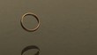 Video: A gold ring falling through the air, bouncing and spinning on granite surface (slow motion) A gold ring falling through the air, bouncing and spinning on granite surface (slow motion)