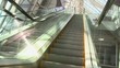 Escalator moving up in modern building