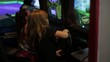 Girls playing video games in arcade