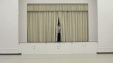 Vidéo : Hispanic man steps out from behind curtains on a stage, checks watch and clipboard Hispanic man steps out from behind curtains on a stage, checks watch and clipboard