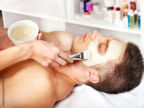 Photo: Clay facial mask in beauty spa. Clay facial mask in beauty spa.