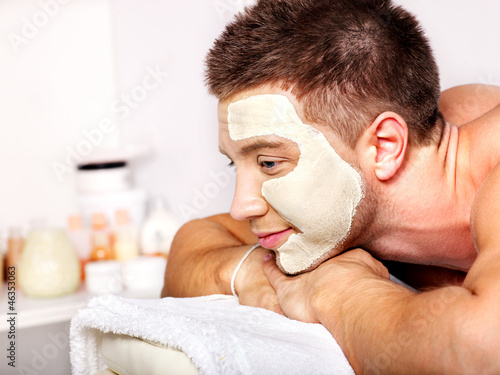 Photo: Clay facial mask in beauty spa. Clay facial mask in beauty spa.