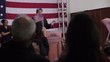 Hispanic political candidate giving speech at podium