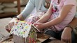 Caucasian mother and daughter making a gingerbread house