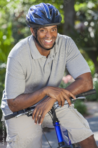Photo: African American Man Riding Bike African American Man Riding Bike
