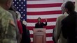 Political candidate addressing applauding crowd